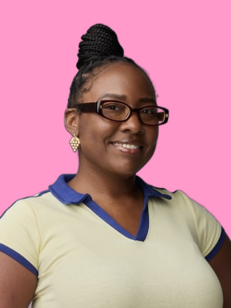 Tolisa T. Abrams smiling in a studio portrait